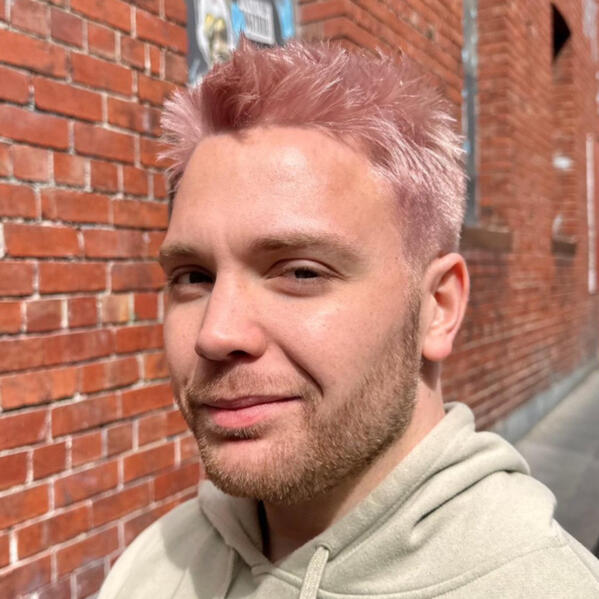 A headshot photo of Alan